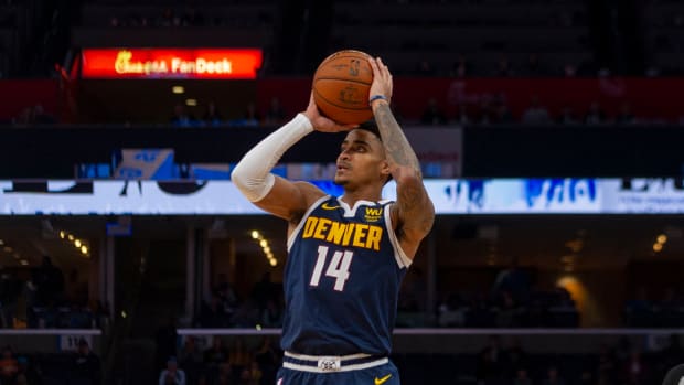 Nuggets shooting guard Gary Harris goes up for a shot in a game against the Grizzlies.